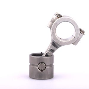 May include: A silver-colored engine piston and connecting rod assembly. The piston is cylindrical with a circular top and bottom. The connecting rod is attached to the piston and has a circular opening at the top.