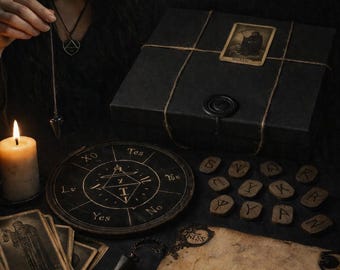 May include: An assortment of divination tools, including tarot cards, a planchette, a Ouija board, and a pendulum. A lit candle and a black box with a tarot card are also present. The theme is mystical and occult.
