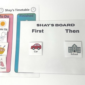 May include: A white timetable and board set with the text "Shay's Timetable" and "SHAY'S BOARD". The timetable has "To Do" and "Finished" sections with illustrations. The board has "First" and "Then" sections with car and school illustrations.