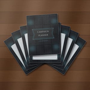 May include: A fan-shaped arrangement of multiple campaign planner booklets. Each booklet features a dark blue, grid-patterned cover with a central rectangular label displaying the text CAMPAIGN PLANNER in white, sans-serif capital letters.