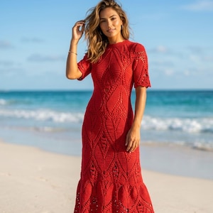 May include: A vibrant red crochet midi dress featuring short sleeves, a high neckline, and an intricate, repeating diamond-shaped openwork pattern throughout the fabric, extending down to a slightly flared hemline at the bottom of the garment.
