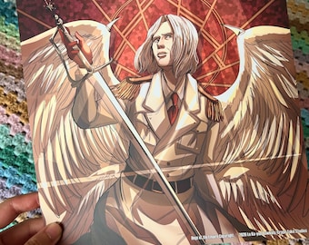 May include: A square art print featuring a light-haired figure with large white wings, wearing a tan military-style coat with gold epaulets and a red tie. The figure holds a long sword upward against a red geometric background with text at the bottom.