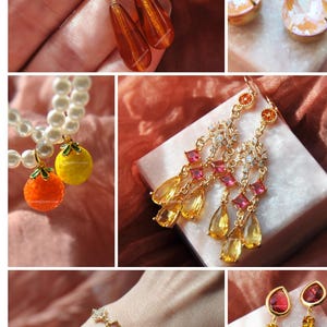 May include: A collection of gold-toned jewelry featuring earrings and a bracelet. The earrings showcase various designs, including teardrop-shaped amber-colored stones, floral accents, and colorful gemstones. The bracelet displays rectangular and square-cut stones.