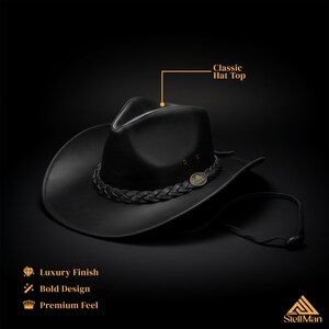 May include: A black cowboy hat with a braided band and a metal emblem. The hat has a classic top and a luxury finish. The design is bold, and the feel is premium. The hat has a chin strap.