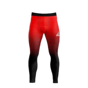 May include: Red and black compression leggings with a dotted pattern that fades from red to black. The leggings have a black waistband and a small logo on the upper right leg. Athletic wear.