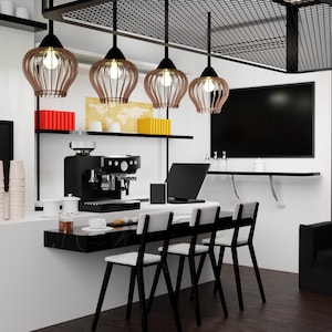 May include: Interior shot of a modern coffee shop with a black espresso machine, pendant lights, and bar seating. The shop features a black countertop, a large flat-screen TV, and a minimalist design with white walls and dark wood flooring.