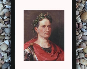 May include: Framed portrait of a man wearing a laurel wreath and red cape. The portrait is in a black frame and set against a background of small, colorful stones. The man's portrait has a signature in the bottom right corner.