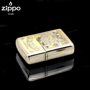 Pode incluir: Um isqueiro Zippo dourado com um design gravado detalhado. O isqueiro tem formato retangular com bordas arredondadas e uma tampa articulada. O design inclui uma imagem de um leopardo e o texto "WIDES" e "TOURIST DOMESTIC RATIO". O logotipo do clube Zippo est&aacute; no canto superior esquerdo.