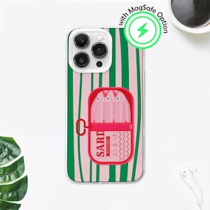May include: Clear phone case with a pink and green striped design. The case features a red sardine can graphic with the word "SARD" and a graphic of sardines. The case has a "MagSafe Option" label.
