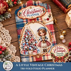 May include: A tri-fold folio planner featuring a red and blue plaid pattern, a Christmas Planner label, and a central oval illustration of a child holding a teddy bear next to a decorated Christmas tree. Includes a gold charm with beads.