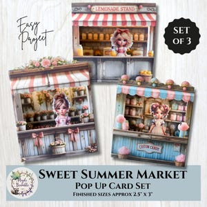 May include: A set of three pop-up cards featuring miniature market stalls. Each card showcases a different theme: a lemonade stand, a flower shop, and a cotton candy stand. The finished sizes are approximately 2.5" x 3".