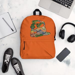 Sac à dos orange vif et imprimé grenouille