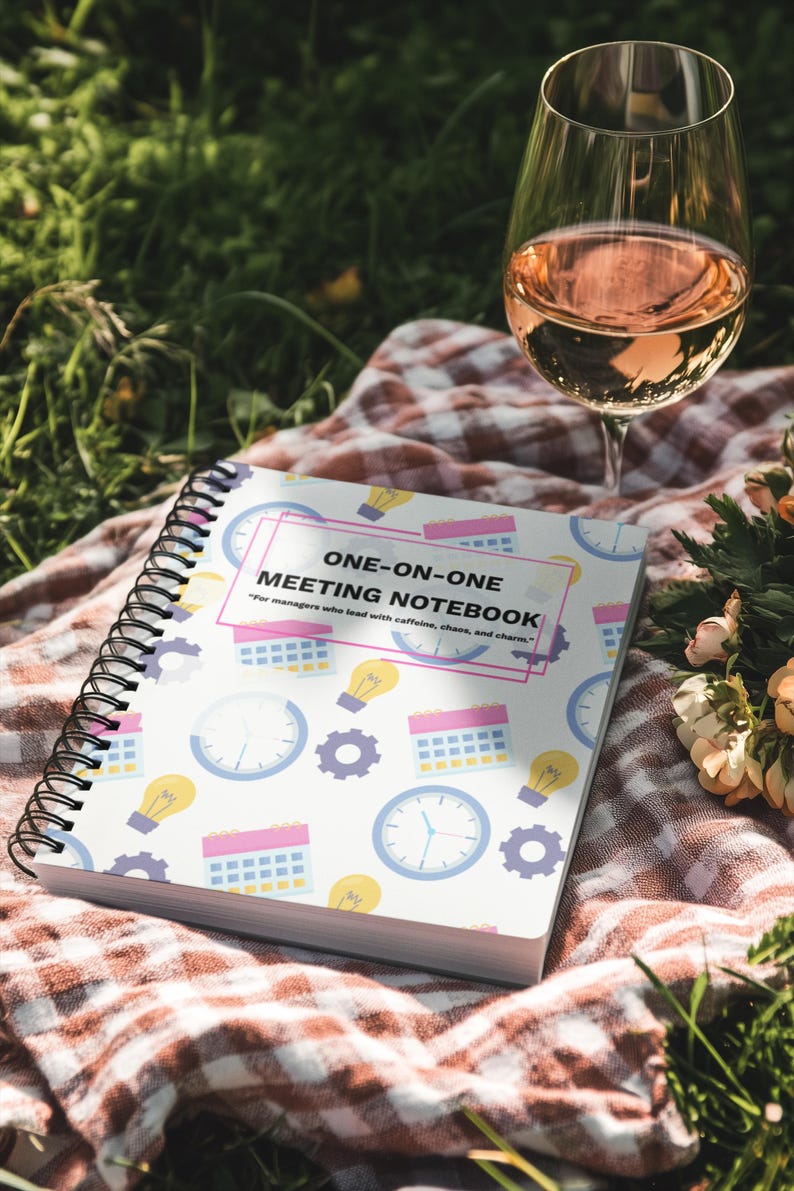 Colorful One-on-One Meeting Notebook spiral journal in an outdoor picnic lifestyle setting