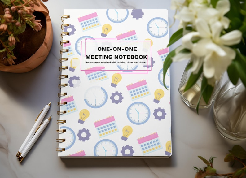 Colorful One-on-One Meeting Notebook flat lay on marble office desk with flowers and workspace accessories