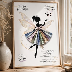 May include: A framed print featuring a black silhouette of a fairy with iridescent wings. The fairy's skirt is made of folded paper currency. The text reads: Happy Birthday! Sei immer DU SELBST, F&uuml;r Dich! Bleib so Einzigartig, und Mutig voller Tr&auml;ume, wie du bist. Glaub immer daran, wie Stark du wirklich bist.