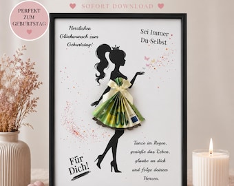 May include: A framed print featuring a black silhouette of a person with a ponytail wearing a dress made from a folded 100 Euro banknote with a cream ribbon. The text includes Herzlichen Glückwunsch zum Geburtstag, Sei Immer Du-Selbst, Für Dich, and Tanze im Regen, genieße das Leben, glaube an dich und folge deinem Herzen.