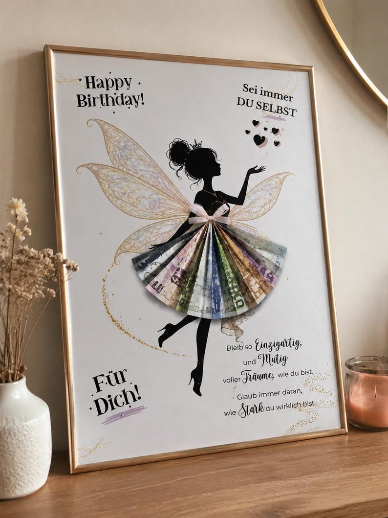 May include: A framed print featuring a black silhouette of a fairy with iridescent wings and a skirt made of folded paper currency. The text reads Happy Birthday, Sei immer DU SELBST, F&uuml;r Dich, and a German quote about being unique and brave.