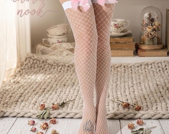 Calze autoreggenti bianche a rete con fiocchi di seta rosa