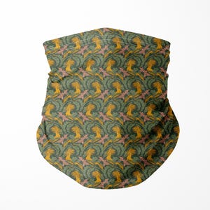 May include: A patterned face covering in shades of green, yellow, and pink. The design features a repeating floral motif. The fabric is gathered at the top and bottom. The background is plain white.