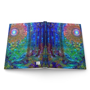 May include: A hardcover book laid open to display a vibrant, symmetrical mosaic-style illustration. The artwork features deep blue, teal, and green tones with two prominent circular sun-like motifs, intricate patterns, and a small white barcode.