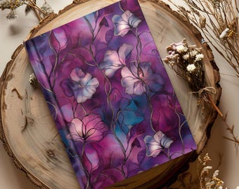 May include: A rectangular hardcover journal featuring a vibrant purple and magenta watercolor-style background with a pattern of delicate, thin-lined floral illustrations in shades of light blue, white, and dark violet throughout the cover.