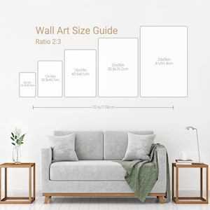 May include: A wall art size guide with the text "Wall Art Size Guide Ratio 2:3". The guide shows five rectangular art sizes: 8x12in, 12x18in, 16x24in, 20x30in, and 24x36in. A sofa and side tables are in the foreground.