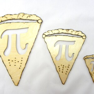 May include: Three wooden pie slice shapes with the mathematical symbol pi cut out of the center. The slices are different sizes and are arranged from largest to smallest.