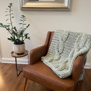 Luxury welcome home blanket gift for new homeowners, elevated alternative to traditional realtor closing gifts and client gifts
