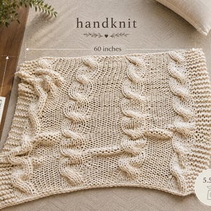 Ivory 50 x 60 cable knit throw blanket showing generous size, substantial texture, and designer-inspired neutral home decor