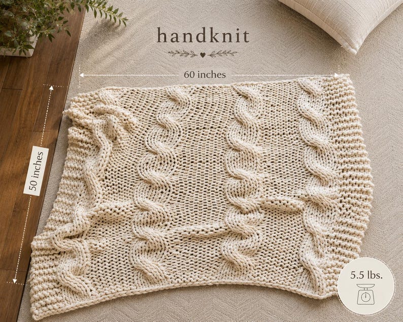Ivory 50 x 60 cable knit throw blanket showing generous size, substantial texture, and designer-inspired neutral home decor