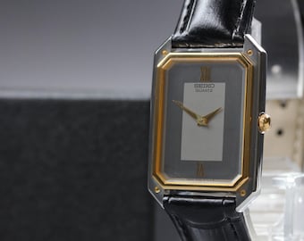 Vintage 1983 [near mint] seiko 6530-5000 two tone roman 25mm quartz men's watch