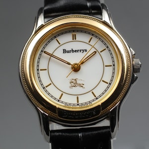 New Batt. [near Mint] Burberrys 6031-g13427 Y Gold Round 25mm Qz