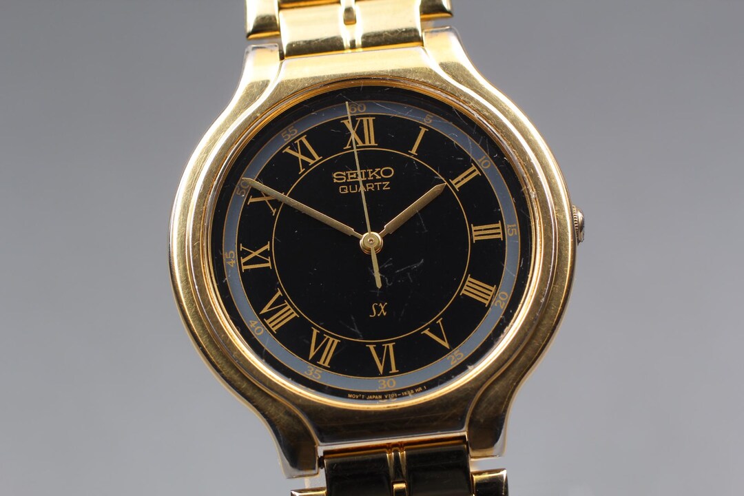 Vintage 1993 Exc+5* Seiko SX V701-6J60 Black Gold 34mm Quartz