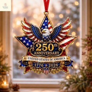 May include: A star-shaped commemorative ornament featuring a bald eagle with spread wings, the American flag, and gold text reading 250th ANNIVERSARY UNITED STATES OF AMERICA 1776-2026. The design includes a red ribbon hanger and gold metallic accents.