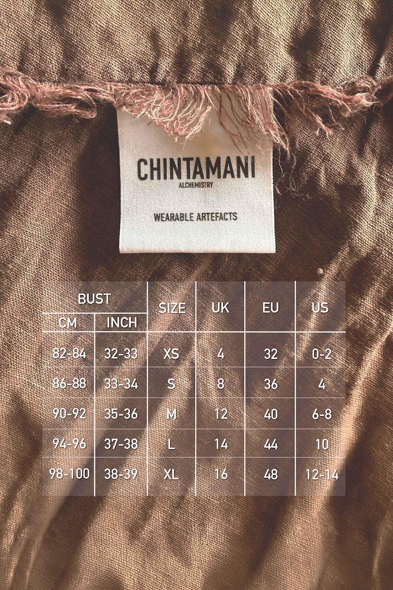 a label with measurements and sizes for a garment, along with a list of bust, size, and country measurements.