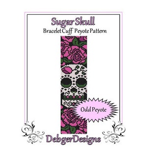 May include: Sugar Skull Bracelet Cuff Peyote Pattern beading project. The pattern features a pink and white sugar skull with floral accents. The pattern is for odd count peyote stitch.