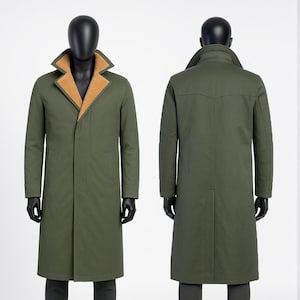May include: An olive green overcoat with a tan-colored, textured collar lining. The coat is displayed on a mannequin, showcasing the front and back views. The coat has a classic design with a long length and a button closure.