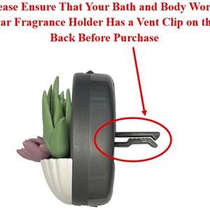 May include: A car fragrance holder with a vent clip, featuring a white and grey planter with faux succulents. The text on the image reads: "Please Ensure That Your Bath and Body Works Car Fragrance Holder Has a Vent Clip on the Back Before Purchase."