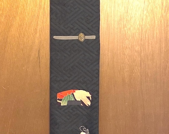 Japanese Obi Wall Hanging, Okina mask pins, silk fiber arts 46” x 6”