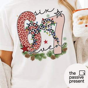 Christmas 67 PNG, Trending TikTok 67 Design, Festive Leopard Christmas Lights Bow PNG, Holiday Shirt Sublimation