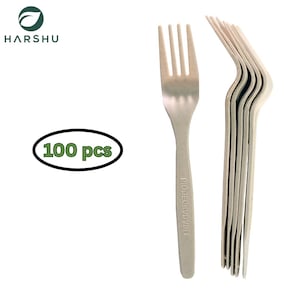 May include: A set of beige disposable forks, with the text "BIODEGRADABLE" printed on the handle. The image also shows a green oval with the text "100 pcs". The forks are made of a light-colored material.