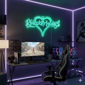 May include: A gaming setup with a neon green "Kingdom Hearts" sign in a heart shape. The desk includes a monitor displaying a video game, a gaming PC, a black and gold gaming chair, and a PlayStation 5.