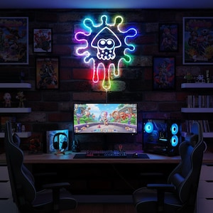 May include: A gaming setup featuring a neon sign of a squid-like character in vibrant colors, mounted on a brick wall. A computer monitor displays a video game, with a keyboard, mouse, and gaming PC visible. Two gaming chairs complete the scene.