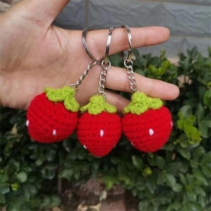 Handmade crochet doll keychain, cute strawberry plush charm, kawaii yarn keyring, mini girl doll bag accessory, soft knitted toy gift