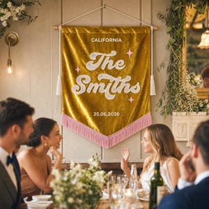 May include: A gold velvet wall banner featuring the text CALIFORNIA, The Smiths, and 25.06.2026 in white lettering. The banner is decorated with small pink star icons, white tassels on the sides, and a pink fringe along the bottom edge.