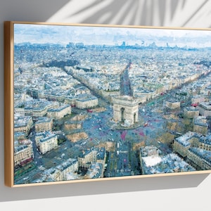 May include: An aerial view painting of Paris, France, featuring the Arc de Triomphe at the center of a roundabout. The artwork is framed in a light wood frame. The painting has a blue and white color palette.