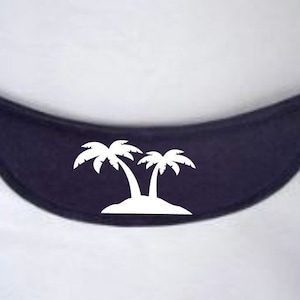 May include: A dark blue fabric headband with a white silhouette of two palm trees on an island.