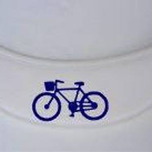 May include: A white fabric patch with a blue silhouette of a bicycle with a basket.