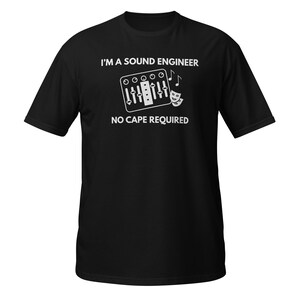 May include: Black t-shirt featuring the text "I'M A SOUND ENGINEER, NO CAPE REQUIRED" in white. A graphic of a sound mixing board, musical notes, and a theatre mask are also included in the design.