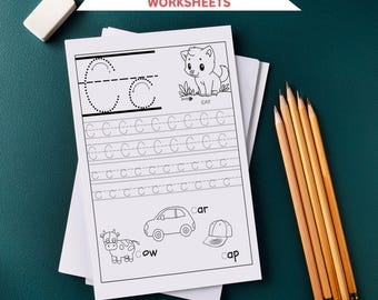 Könnte beinhalten: Alphabet-Tracing-Arbeitsblätter mit dem Buchstaben "C" und Illustrationen einer Katze, eines Autos, einer Kuh und einer Kappe. Die Arbeitsblätter enthalten gepunktete Linien zum Nachzeichnen des Buchstabens und der Wörter. Ein weißer Radiergummi und Bleistifte sind ebenfalls vorhanden.